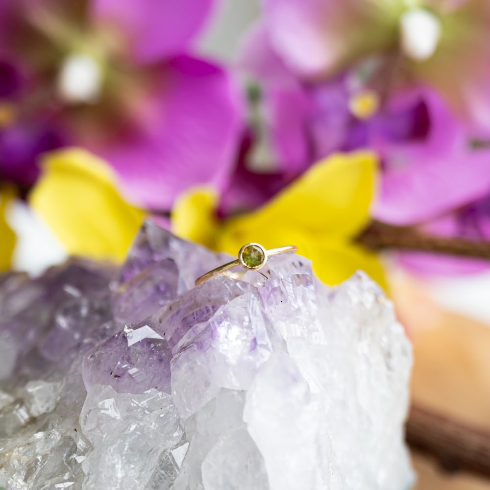 peridot ring on raw amethyst