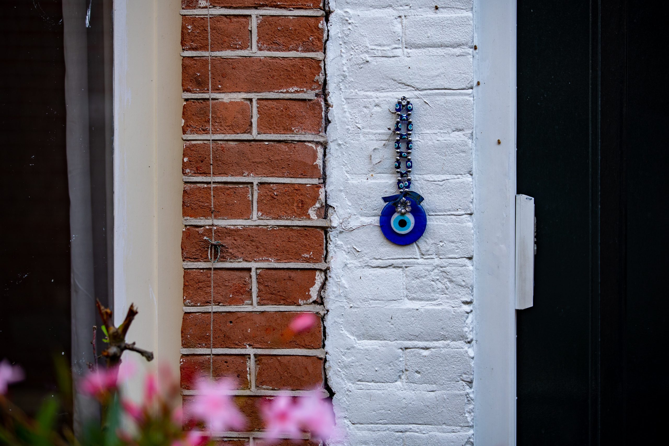 blue glass evil eye protection on house