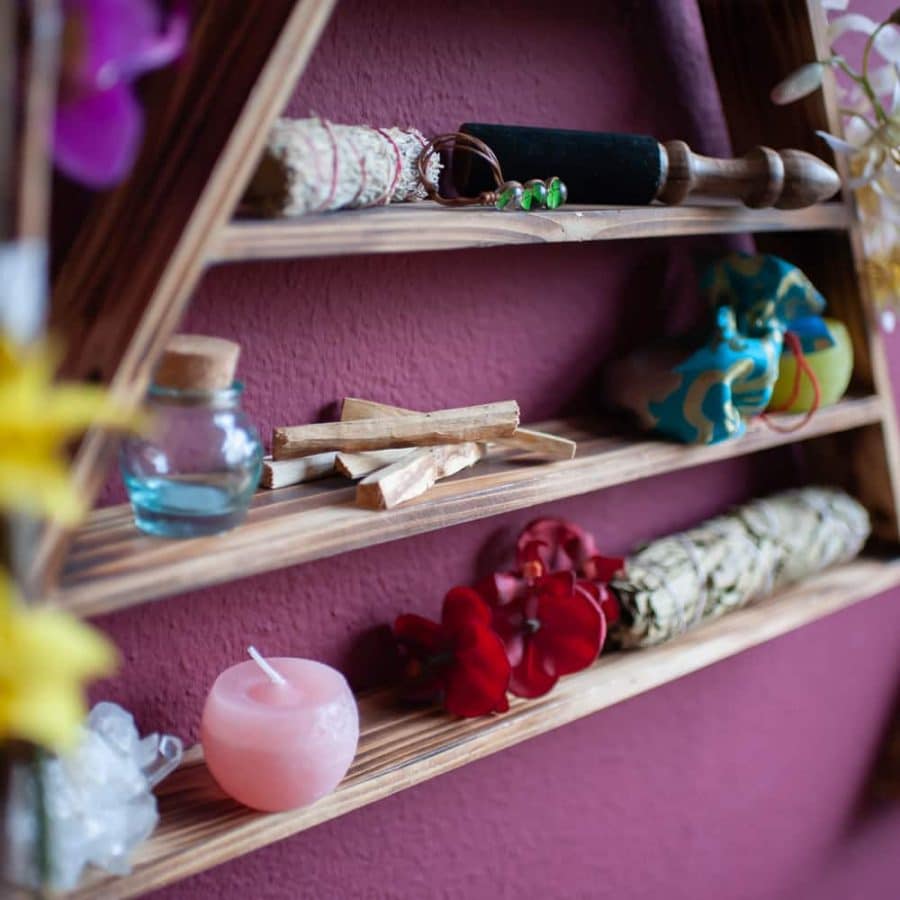 wiccan altar with palo santo and smudge