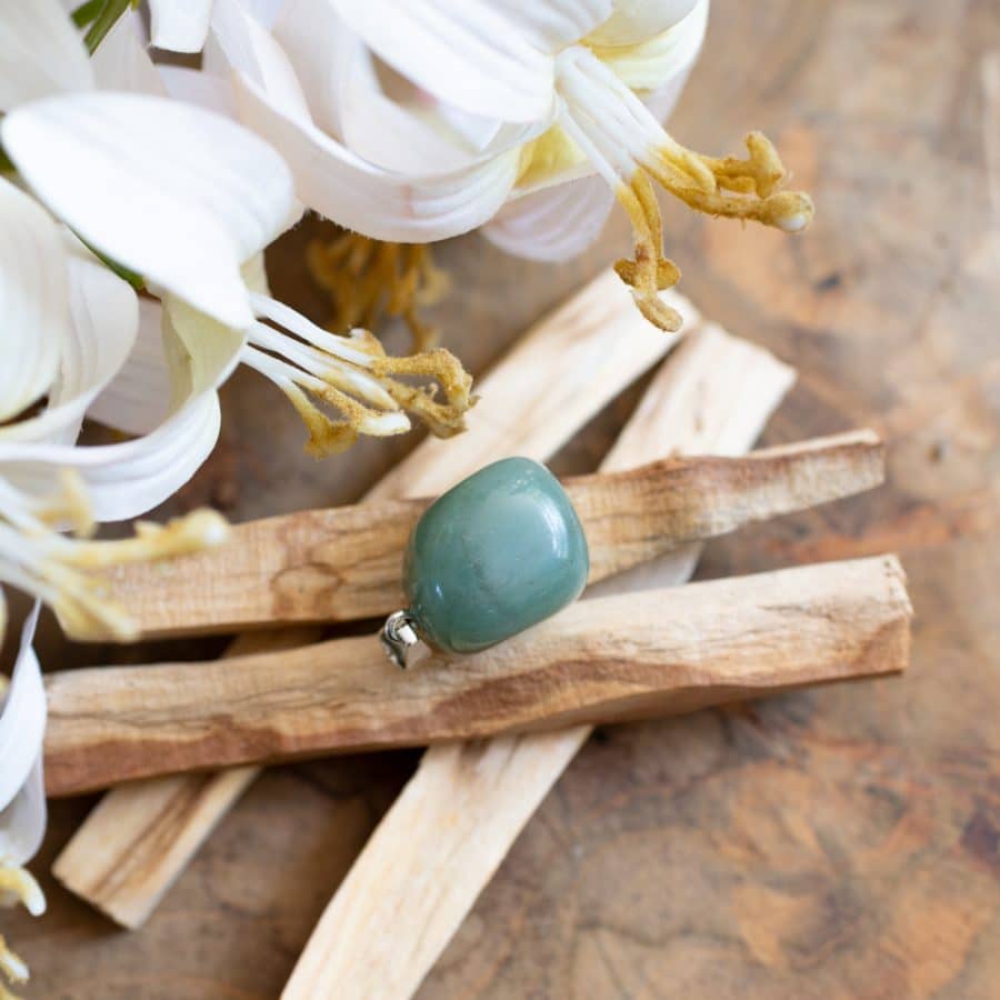 polished aventurine pendant on palo santo