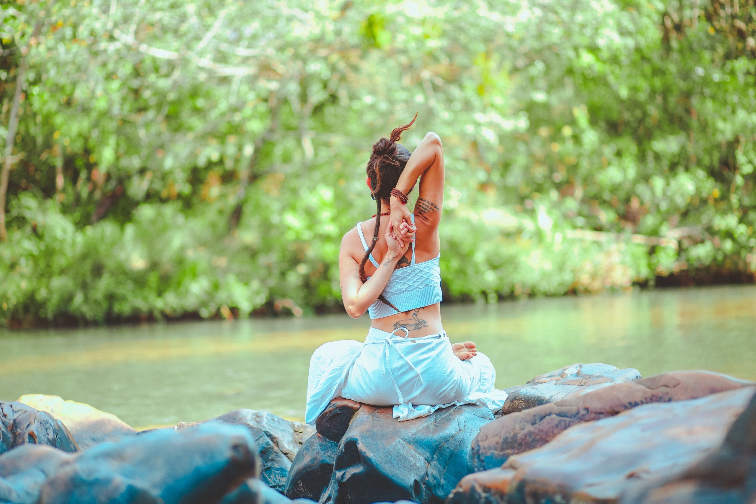 yoga by river woman in white