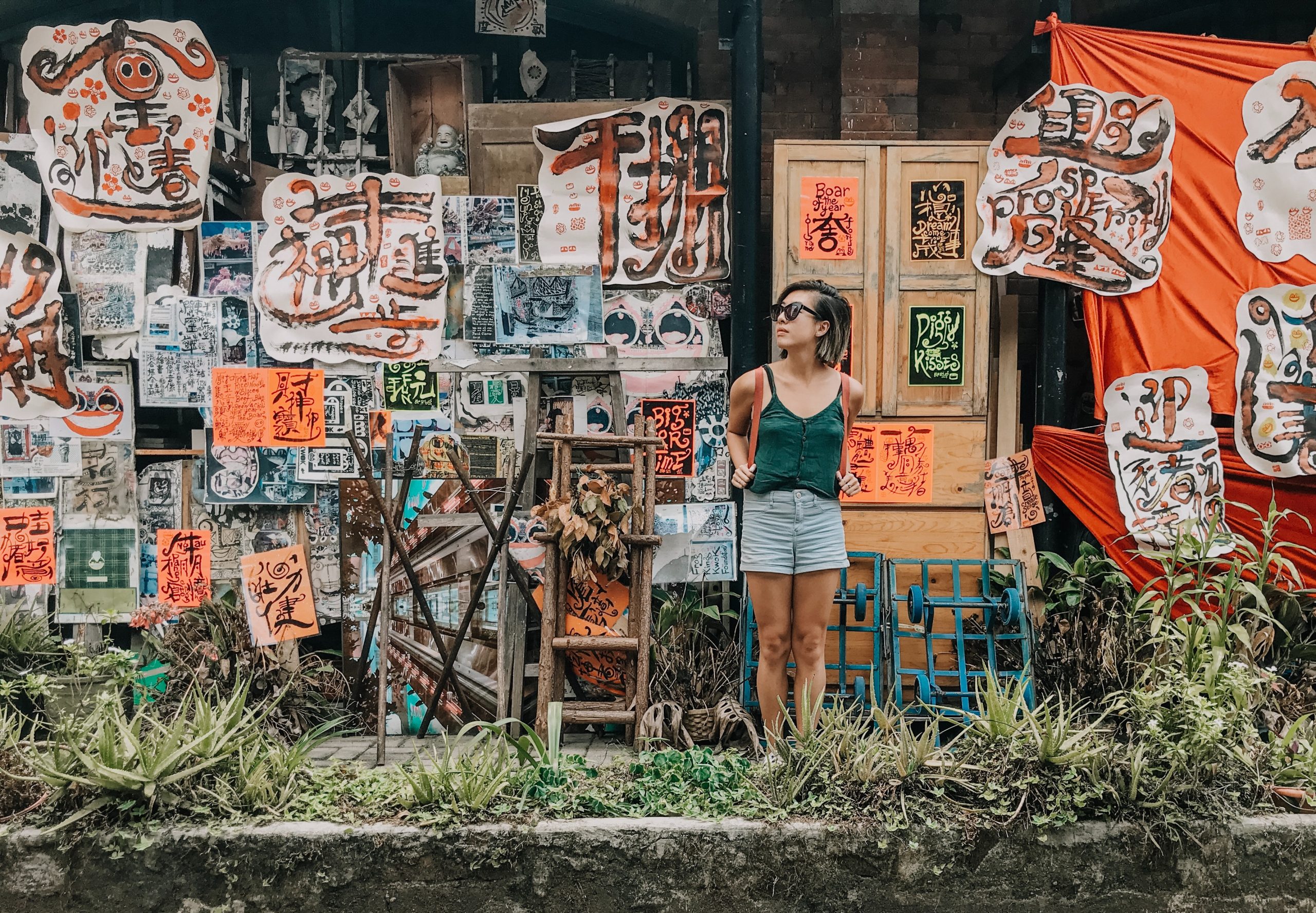 woman in front of art stand
