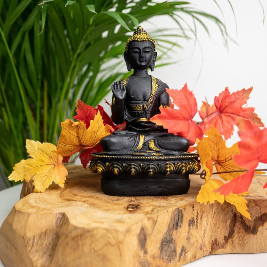 buddha seated mudra sculpture dark and gold