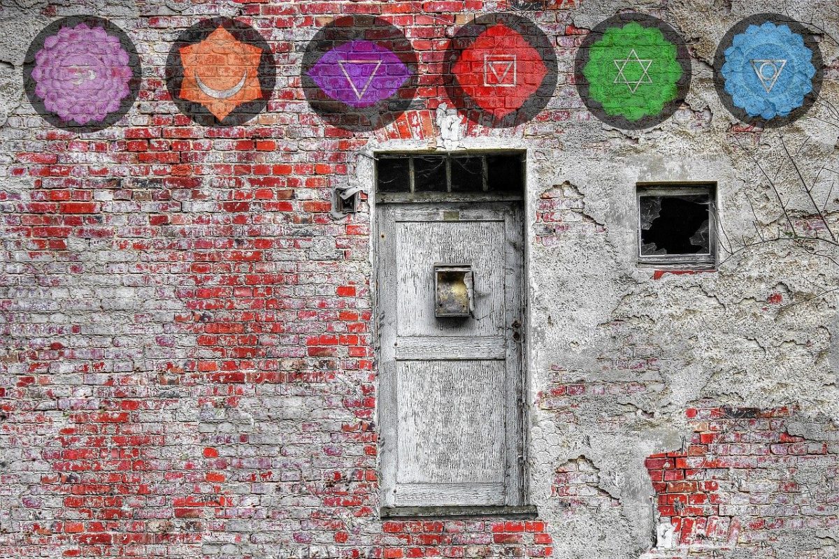 chakra symbols painted on wall above door