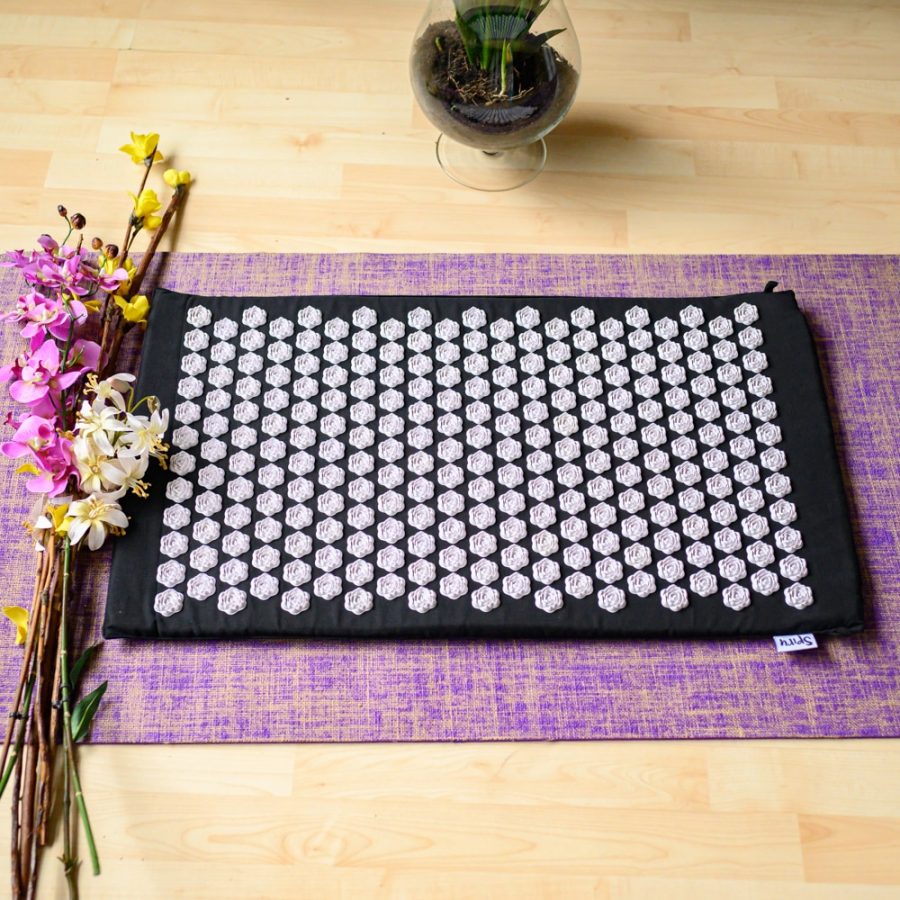 shakti mat with lotus points on meditation mat flowers