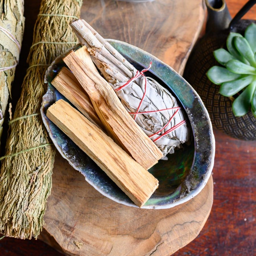 palo santo and white sage smudge in abalone shell