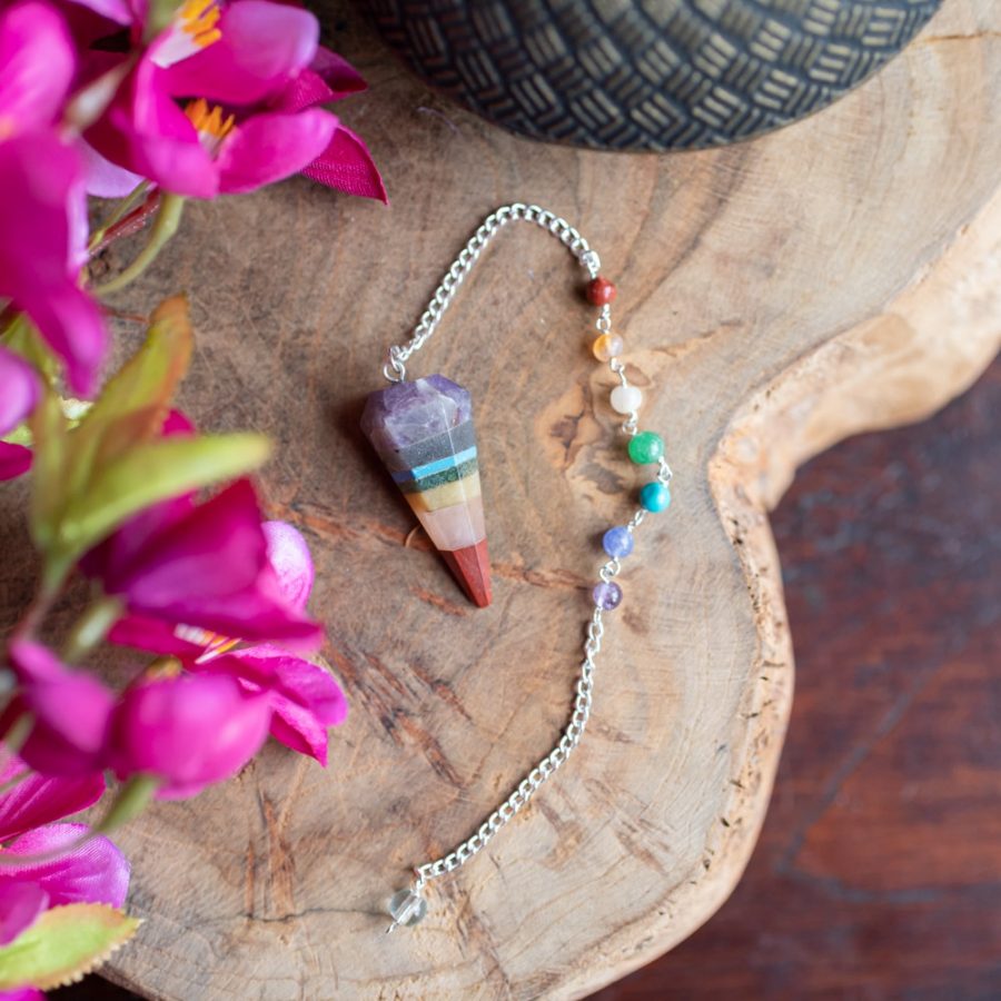 chakra pendulum with flowers and teapot