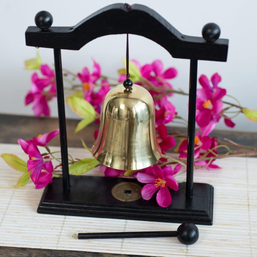 feng shui bell on reed mat