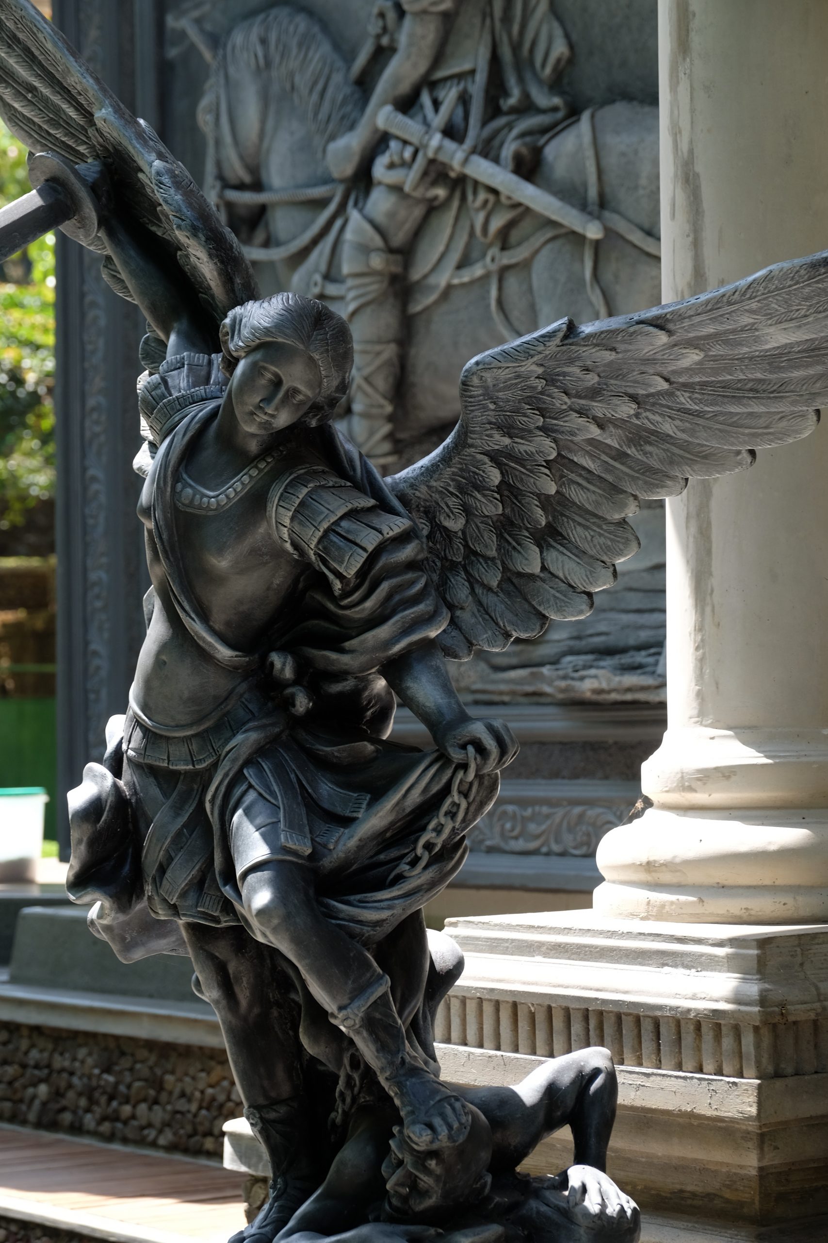sculpture archangel michael putting lucifer in chains