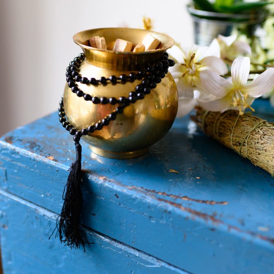 black mala beads with palo santo and sage
