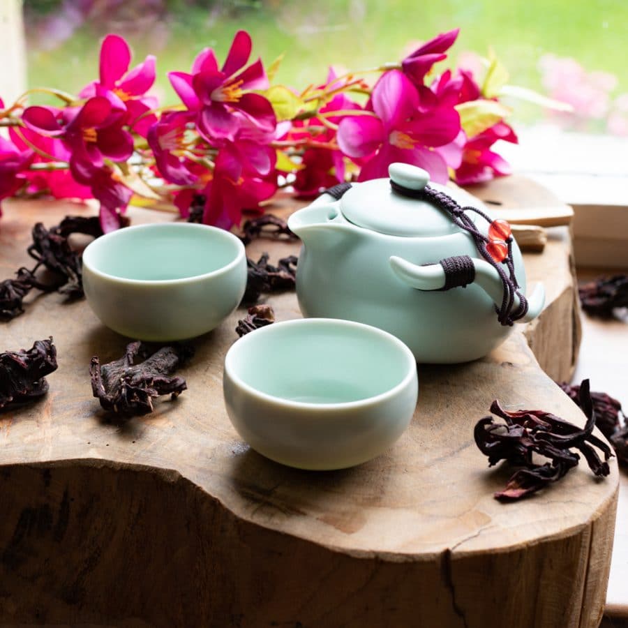 green tea pot by window