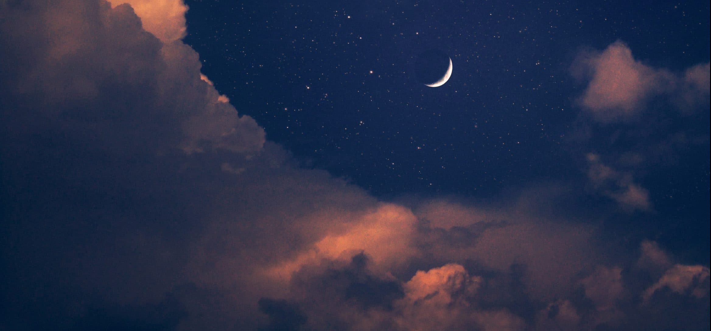 moon in sky with stars blue pink clouds