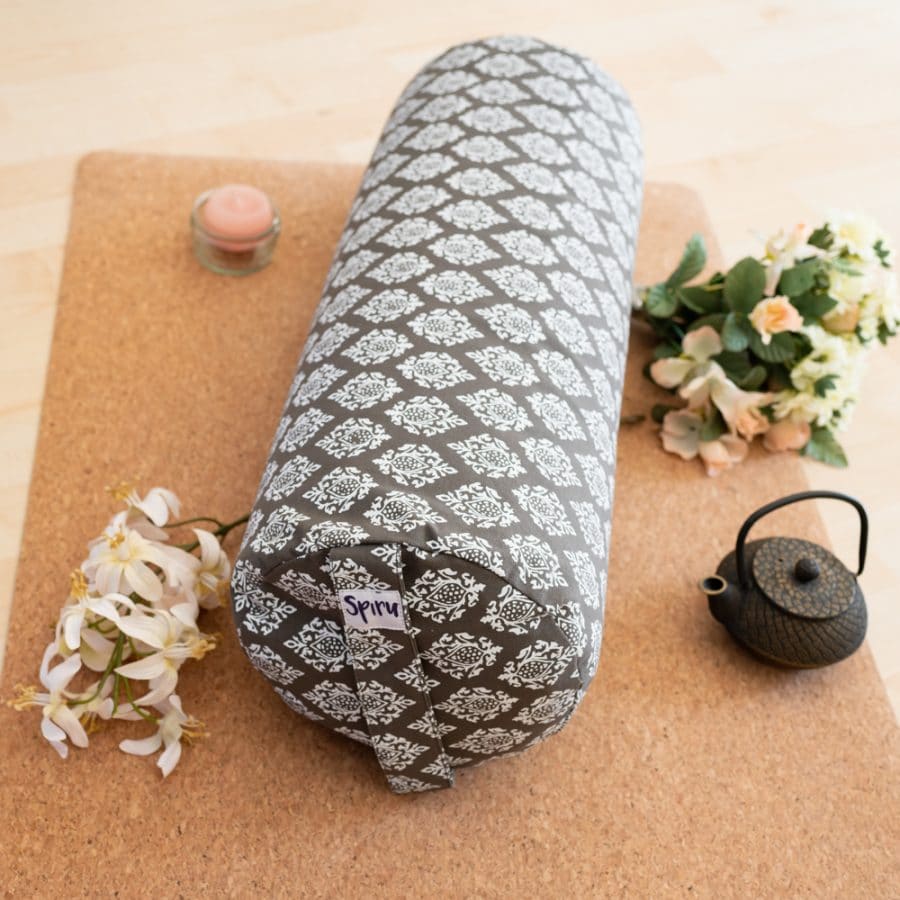 spiru round yoga bolster on cork mat