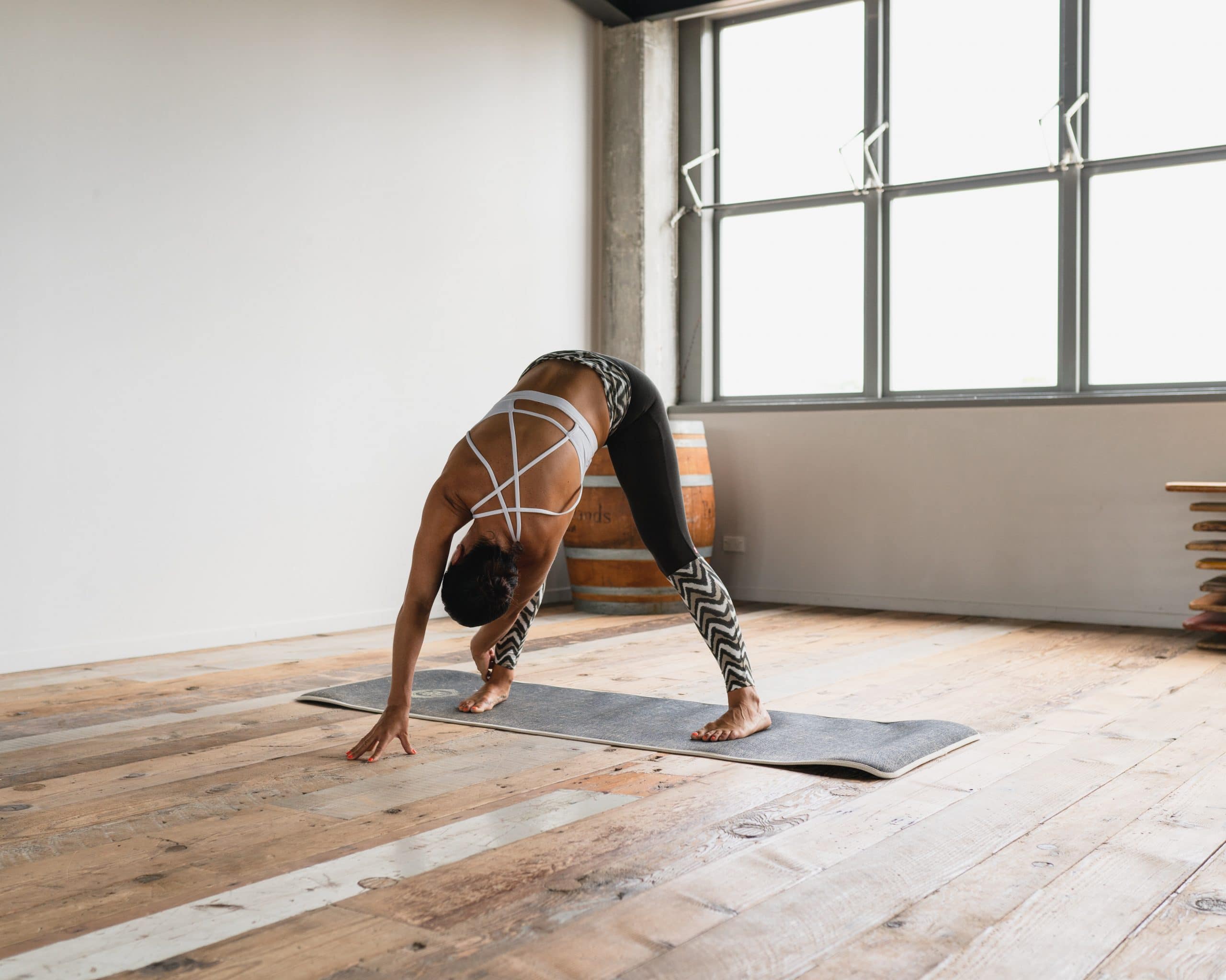 yoga woman wide legged forward fold