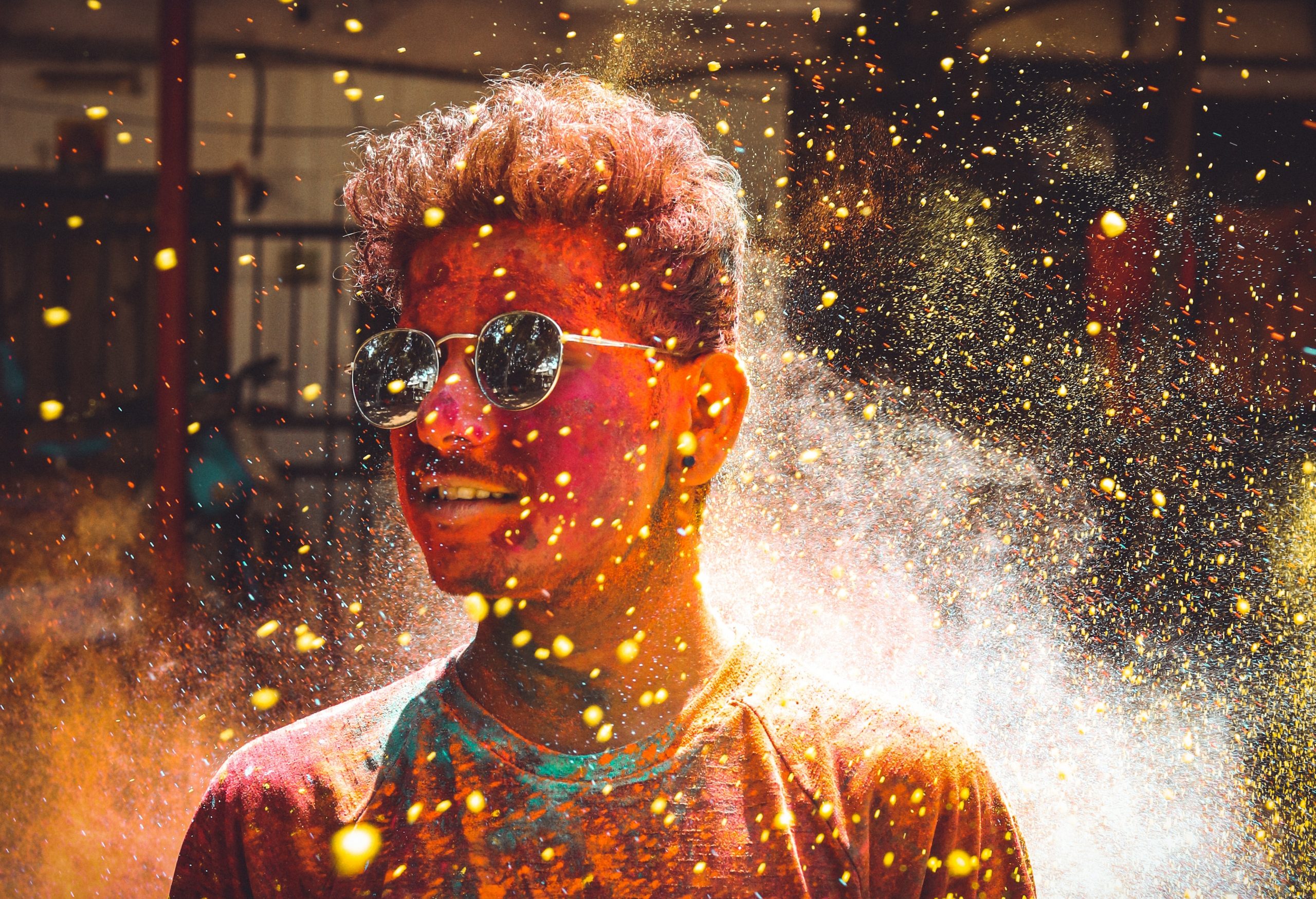 Holi powder man in sunglasses